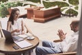 business people talk at an informal meeting in a cafe . Royalty Free Stock Photo