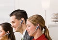 Business people talking on headsets Royalty Free Stock Photo