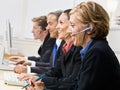 Business people talking on headsets Royalty Free Stock Photo