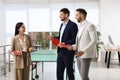 Business people talking near ping pong table in office Royalty Free Stock Photo