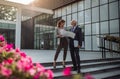 Business people talking about project in front of office building Royalty Free Stock Photo