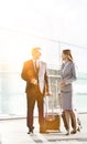 Business people talking while walking with their suitcase in airport Royalty Free Stock Photo