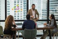 Business people team colleagues in modern office. Man and woman meeting conference and presentation in room Royalty Free Stock Photo