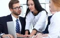 Business people team at meeting in office. Focus at business woman pointing into laptop. Teamwork or coaching concepts Royalty Free Stock Photo