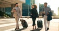 Business people, team walking and travel with suitcase in city for corporate, job opportunity and networking Royalty Free Stock Photo