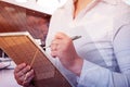 Business, people and technology concept - double exposure businesswoman with notebook over city background Royalty Free Stock Photo