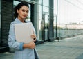 Business, people, tehnology and lifestyle concept: portrait of a young African American woman work with laptop, outdoors Royalty Free Stock Photo