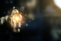 Business People touch Light bulb.Concept of Ideas for Success. Concept with Innovation Invention. Success Starting from a new idea Royalty Free Stock Photo