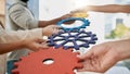 Business people, toys and gears at job for teamwork, sign or symbol with solution, trust and solidarity. Corporate group Royalty Free Stock Photo