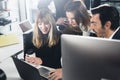 Business people using computers and laptops. Coworkers working together in modern office.Horizontal.Blurred background. Royalty Free Stock Photo