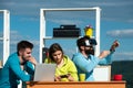 Business people using virtual reality goggles. Team of young business people testing virtual reality headset and