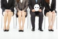 Business People Waiting For Job Interview With A Strange Mask