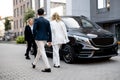 Business people walk to minivan taxi Royalty Free Stock Photo