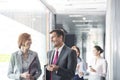 Business people walking in corridor Royalty Free Stock Photo