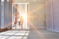 Business people walking while discussing plans before meeting with yellow lens flare