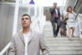 Business people walking down the stairs Royalty Free Stock Photo