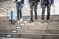 Business people walking down the stairs. On the way back from work Royalty Free Stock Photo