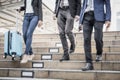 Business people walking down the stairs. On the way back from work Royalty Free Stock Photo