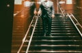 Business people walking on escalator in office building. Motion blur Royalty Free Stock Photo