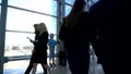 Business people walking in glass building