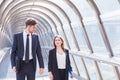 Business people walking in office corridor interior Royalty Free Stock Photo