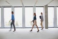 Business people walking in office hall Royalty Free Stock Photo