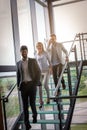 Business people walking on the stairs and having discussion. Bus Royalty Free Stock Photo