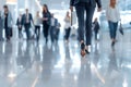 Business people walking swiftly through an office lobby with modern white interior design Royalty Free Stock Photo