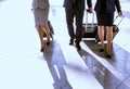 Business people walking with their suitcase in airport Royalty Free Stock Photo