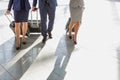 Business people walking with their suitcase in airport Royalty Free Stock Photo