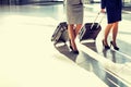 Business people walking with their suitcase in airport Royalty Free Stock Photo