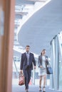 Business people walking together in the corridor at modern office building Royalty Free Stock Photo