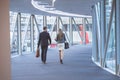 Business people walking together in the corridor at modern office building Royalty Free Stock Photo