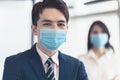 Business people wearing medical face mask while working in office Royalty Free Stock Photo