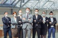 Business people wearing surgical masks