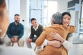 Business people, women and hug in group therapy with care, love and bonding for mental health in workplace. Corporate Royalty Free Stock Photo