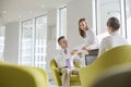 Business people working in office lobby