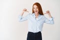 Business people. Young redhead female pointing at herself and smiling confident, standing over white background Royalty Free Stock Photo