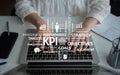 Business performance metrics and key performance indicators with hands typing on laptop in modern office environment Royalty Free Stock Photo