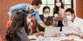 Business person brainstorm in meeting room with face mask