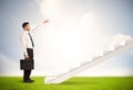 Business person climbing up on white staircase in nature Royalty Free Stock Photo