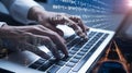 Business Person Coding on Laptop with Cityscape Overlay - Technology and Software Development Royalty Free Stock Photo