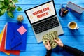 Business person counting dollars by laptop on blue wooden table with stationery, Value Royalty Free Stock Photo