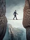 Businessman walking on tightrope between rocks