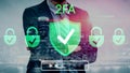 Business Person Embracing Two-Factor Authentication with Digital Security Symbols and Cityscape Background for Royalty Free Stock Photo