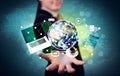 Business person holding laptop and globe Royalty Free Stock Photo