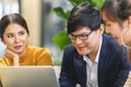 Business person man and woman teamwork meeting talking for job with laptop in office space. Royalty Free Stock Photo