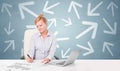 Business person sitting at desk with direction concept Royalty Free Stock Photo