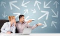 Business person sitting at desk with direction concept Royalty Free Stock Photo