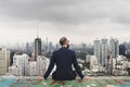 Business Person Sitting Rooftop Concept